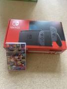 Vendo consola Nintendo Switch V2, Joy-Con Grises y MarioKart Deluxe8, USD 195.00